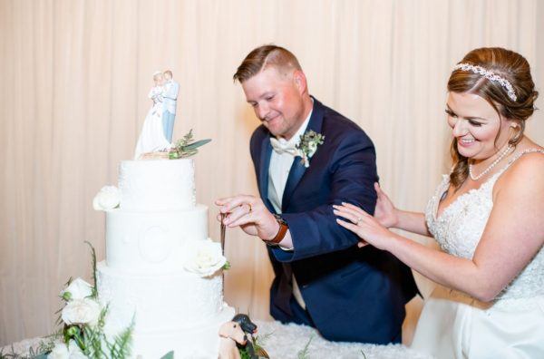 Couple Cutting Wedding Cake